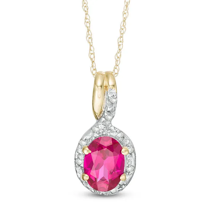 Necklaces Goldia Oval LabCreated Ruby and 005 CT TW Diamond Frame Bypass Pendant in 10K Yellow Gold Necklaces Goldia Oval LabCreated Ruby and 005 CT TW Diamond Frame Bypass Pendant in 10K Yellow Gold