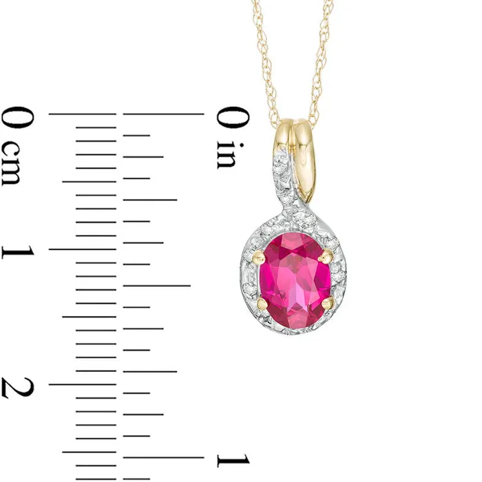 Necklaces Goldia Oval LabCreated Ruby and 005 CT TW Diamond Frame Bypass Pendant in 10K Yellow Gold Necklaces Goldia Oval LabCreated Ruby and 005 CT TW Diamond Frame Bypass Pendant in 10K Yellow Gold